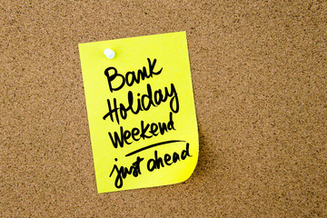 Bank Holiday Weekend Just Ahead written on yellow paper note - 111783958