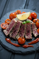 Slices of tuna fillet roasted in sesame seeds, close-up