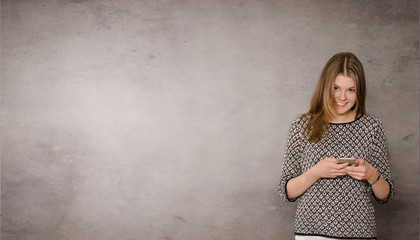 Fototapeta premium Happy teenager with a mobile phone