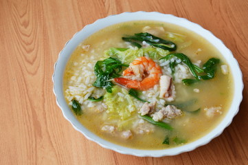 rice porridge with seafood and pork on bowl