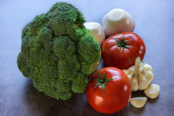 Fresh vegetables, broccoli, tomatoes, onion and garlic