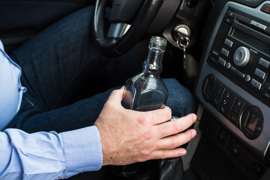 Man Drinking Alcohol In The Car.