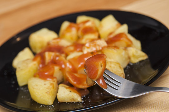 Spanish food: delicious "patatas bravas", hot and spicy potatoes.