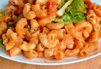 stir fried macaroni with egg and ketchup on white plate