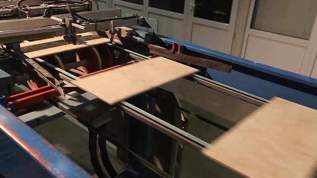 Sorting and packaging of ceramic tiles on a fully automated packaging line. Production of ceramic tiles. Ceramic tile factory.  Making ceramic tile.