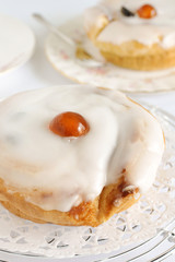 Belgian Bun a fruit cake covered in fondant icing