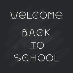 Welcome Back to school, chalk letters on black chalkboard