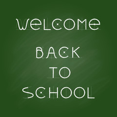 Welcome Back to school, chalk letters on green chalkboard