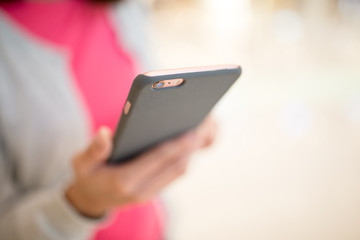 Woman holding on smart phone