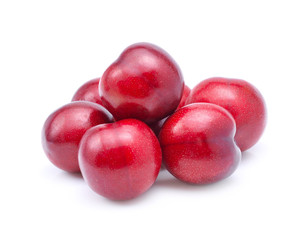 Red plums isolated on white background