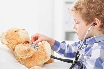  Child Doctor Checking a Teddy Bear's Heartbeat.