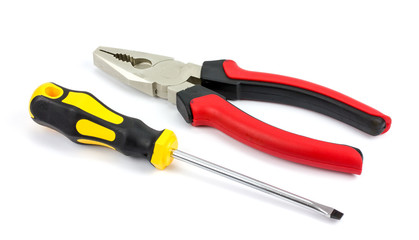 screwdriver and pliers on a white background