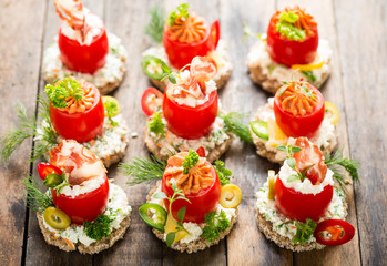 Canapes with stuffed cherry tomatoes 