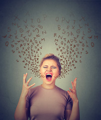angry woman screaming, alphabet letters coming out of open mouth