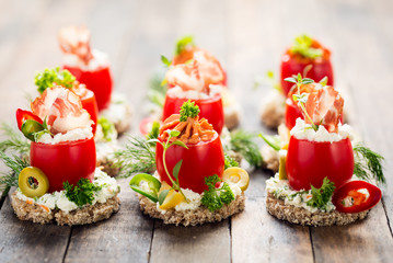 Canapes with stuffed cherry tomatoes 