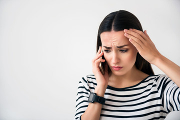 Disappointed woman talking on cell phone  