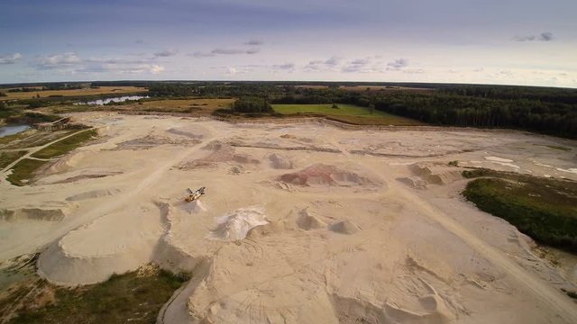 A limestone quarry area in the middle of the forest. Limestone is a sedimentary rock composed largely of the minerals calcite and aragonite