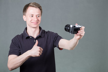 Young guy taking selfie