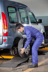 Technician Replacing Car Tire