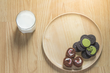 Obraz na płótnie Canvas Chocolate cookies with green tea cream filling , Chocolate rolls