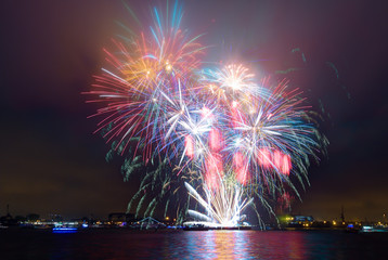 Colorful fireworks on the sea side.