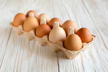 Ten brown eggs