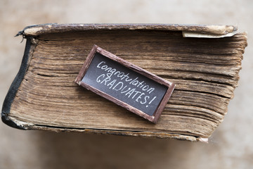 congratulations graduates text and vintage book