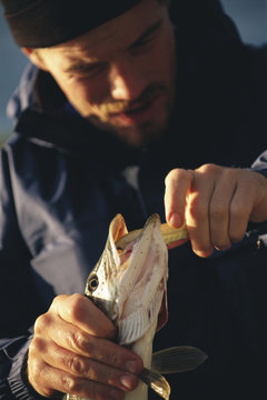 Fisherman holding a fish