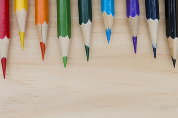 Obraz premium pencils color on wood table.