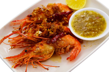  King prawns with deep fried garlic and Seafood sauce on dish on