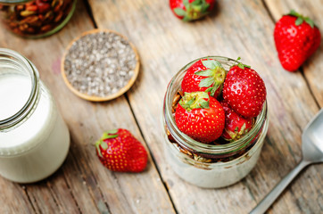 Chia seeds granola Greek yoghurt pudding with strawberries