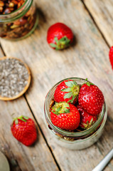 Chia seeds granola Greek yoghurt pudding with strawberries