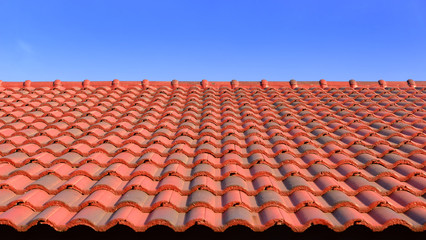 the red ceramic roof tile with sun light and blue sky