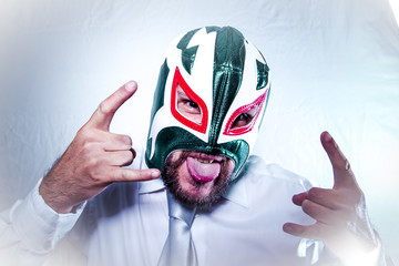 Bad, angry businessman with Mexican wrestler mask, expressions o