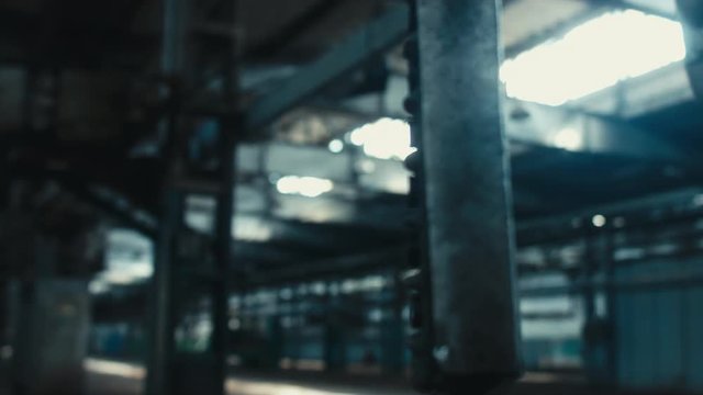 Close up shot of a swinging remote controller on abandoned factory. Scary, catastrophe, horror concept. Blackmagic URSA Mini RAW graded footage