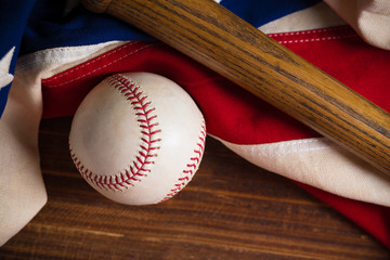 Baseball, bat on a wooden background