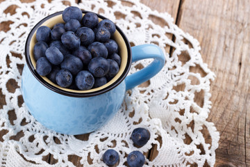 Ripe blueberries in a cup