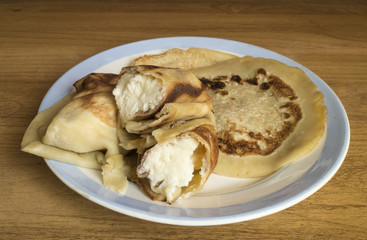 Fototapeta na wymiar Home pancakes with pot cheese