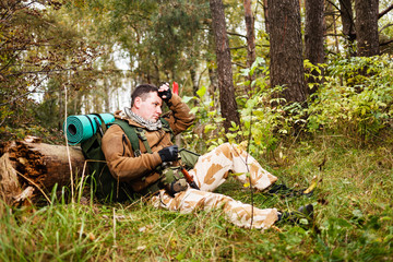 Soldier relaxing in a forest