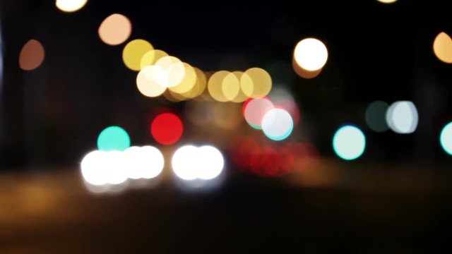 Wandering lights. Blurred city traffic at night