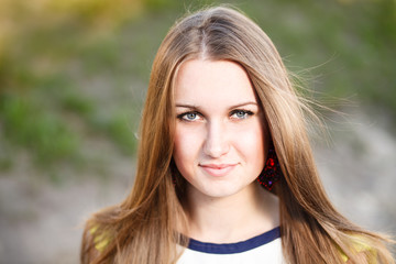 Naklejka premium Long hair girl`s portrait outdoor.