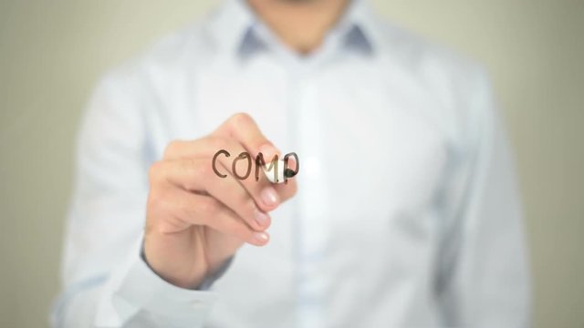 Computing, man writing on transparent screen
