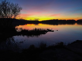 Scenic view of loch of loirston at sunset