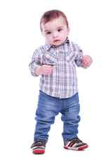 Portrait of small boy in blue trousers striped t-shirt