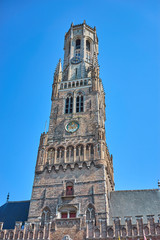 Fototapeta na wymiar Belfry of Bruges in Belgium / Looking up Belfry - landmark of Bruges