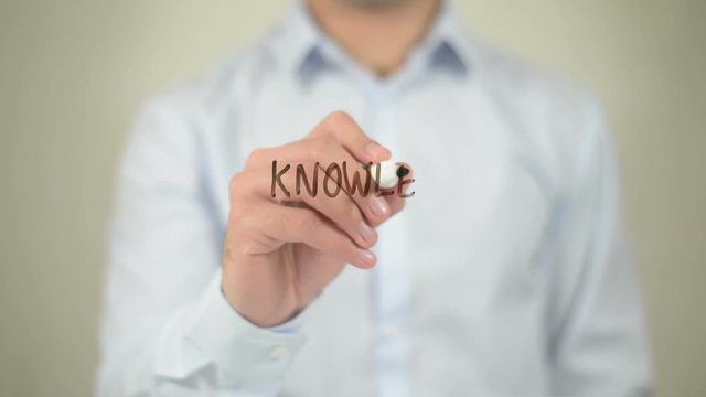 Knowledge Boost , man writing on transparent screen