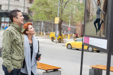 Couple tourist looking street exhibition