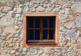 Fototapeta na wymiar Window and stone wall