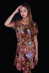 Beautiful girl in Studio on dark background dress