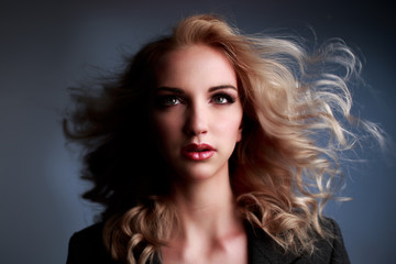 Fototapeta premium Portrait of beautiful young woman in Studio
